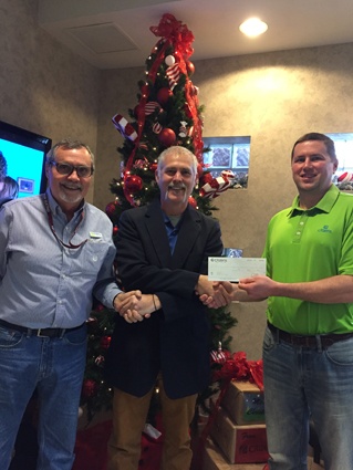 Jamie Reygle receives $250 from Billy Motley and Chris Bond at Citizens