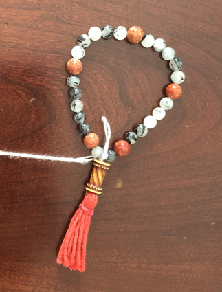 Coral and tourmalinated quartz bracelet