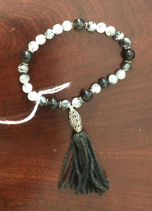 Tourmalinated quartz with jet bracelet